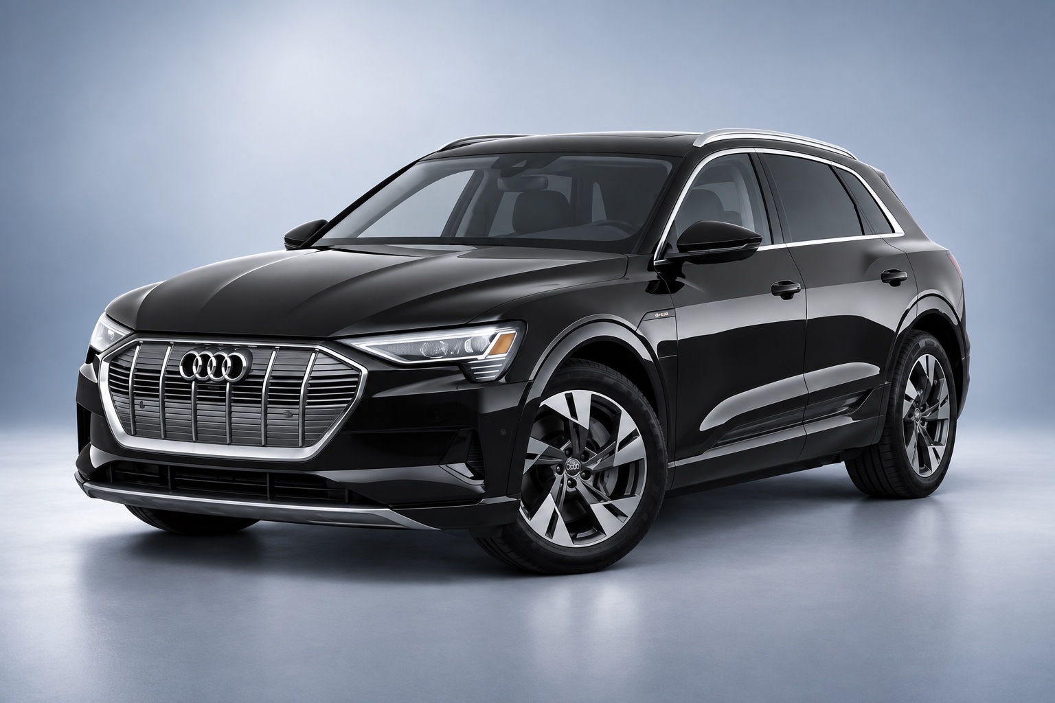 Black Audi e-tron in a premium studio setting